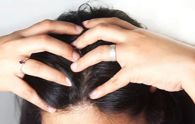 hands giving a self scalp massage for hair growth