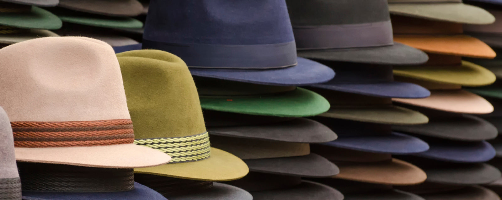stack of fedoras hats