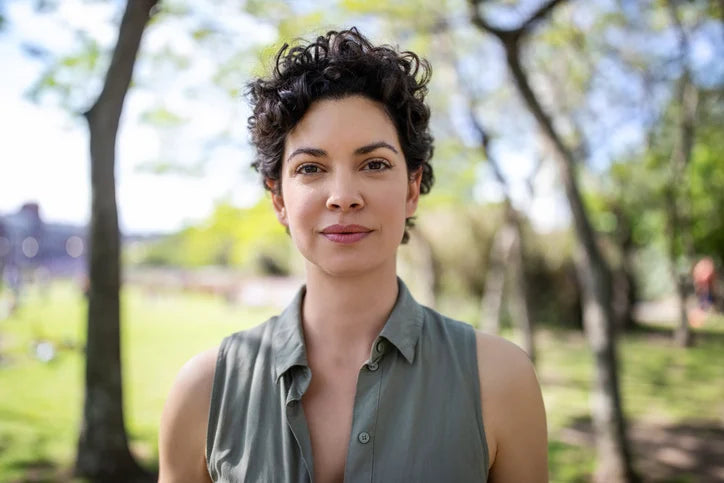 woman outdoor sporting a short wavy hairstyle
