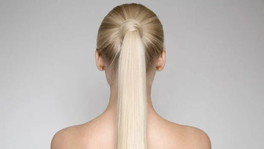 back view of a women head with a ponytail