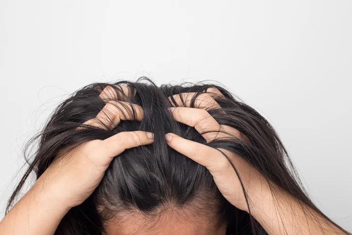 woman running her hand through her hair
