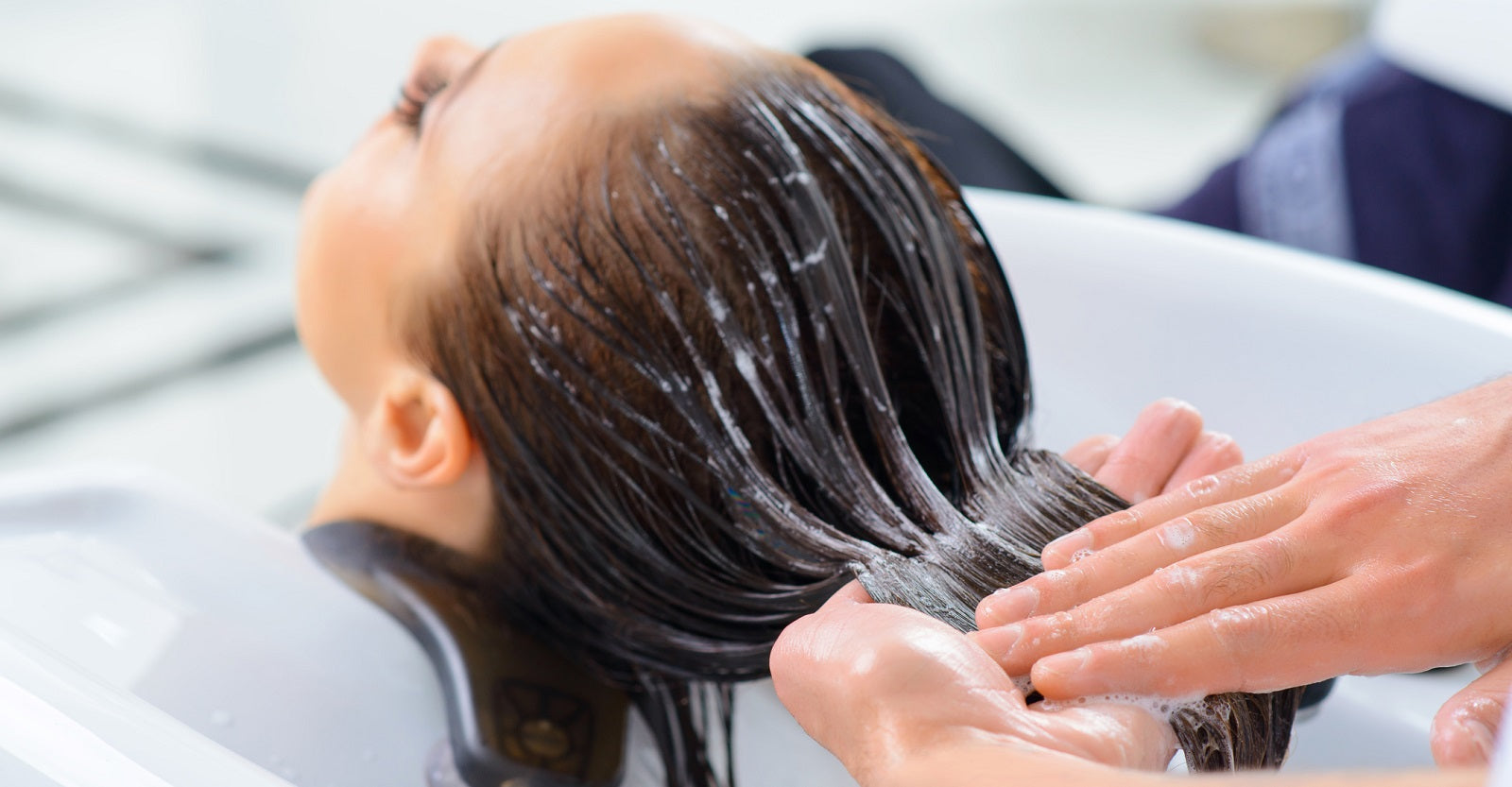 woman having her hair washed at the salon