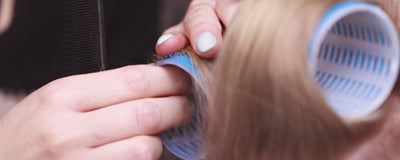 close up image of hair roller being applied