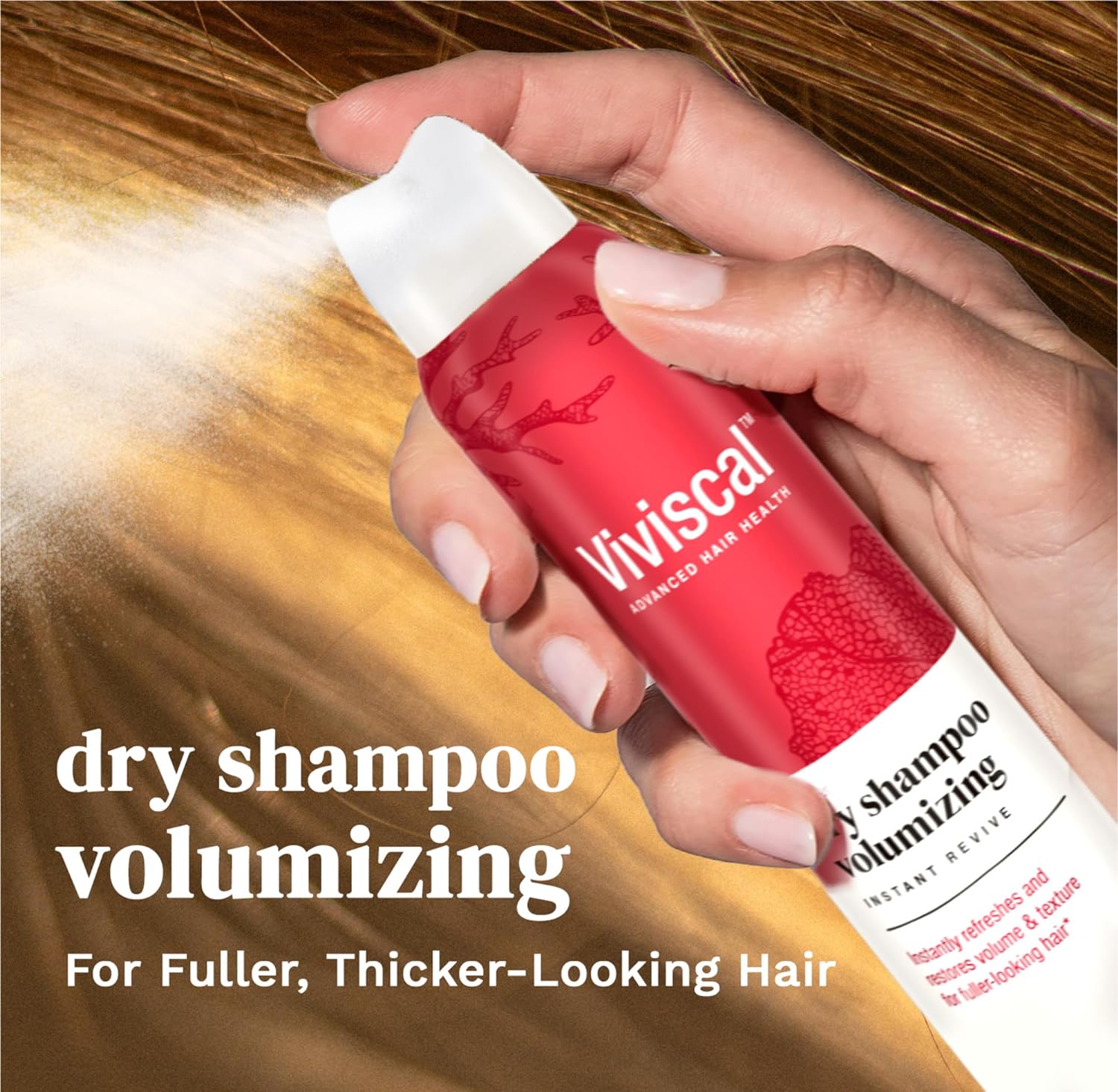 a hand spraying Viviscal dry shampoo volumizing for fuller, thicker-looking hair